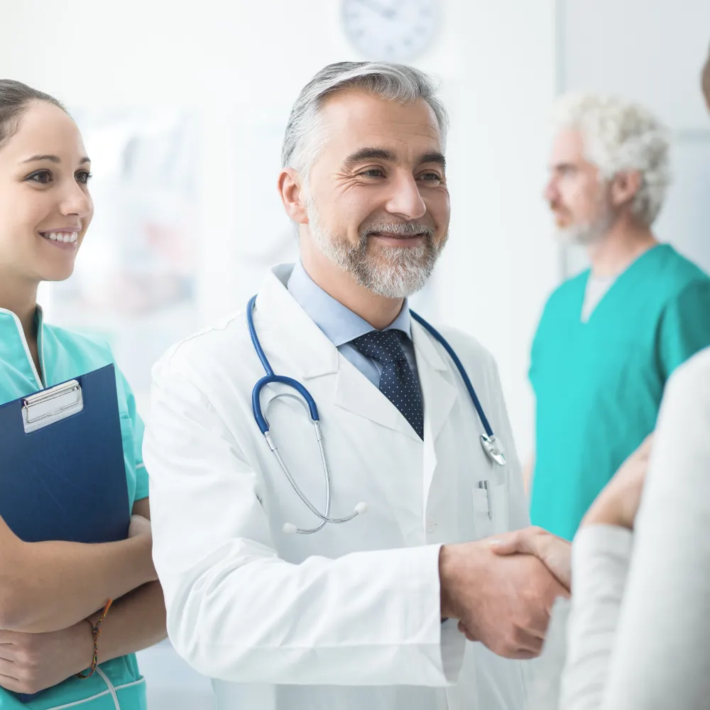 doctor shaking hands with pacient