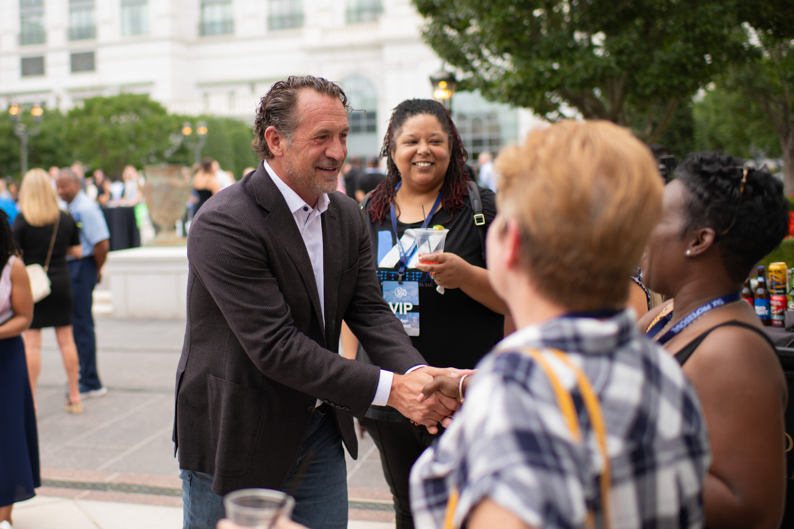 Mark J. Kohler shaking hands