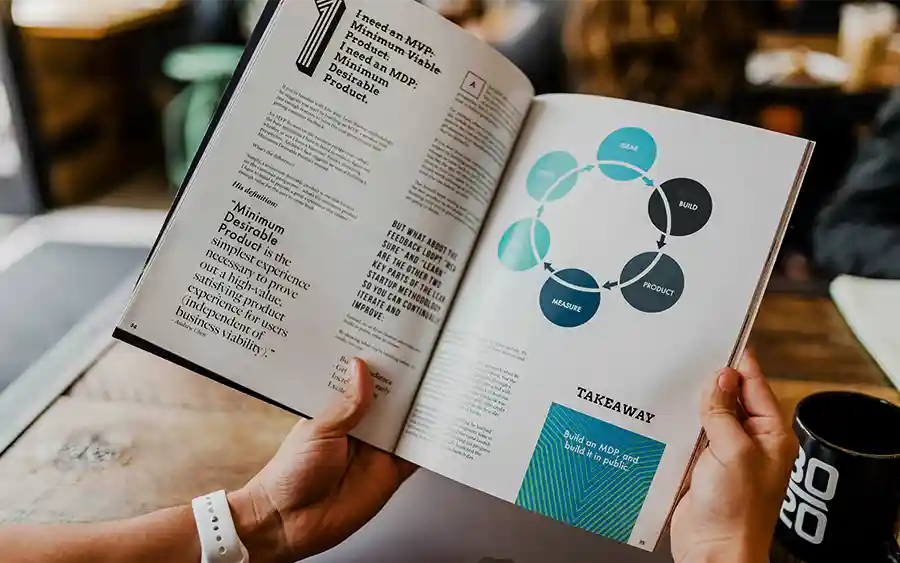 Business person reading a helpful bubble map of topics.